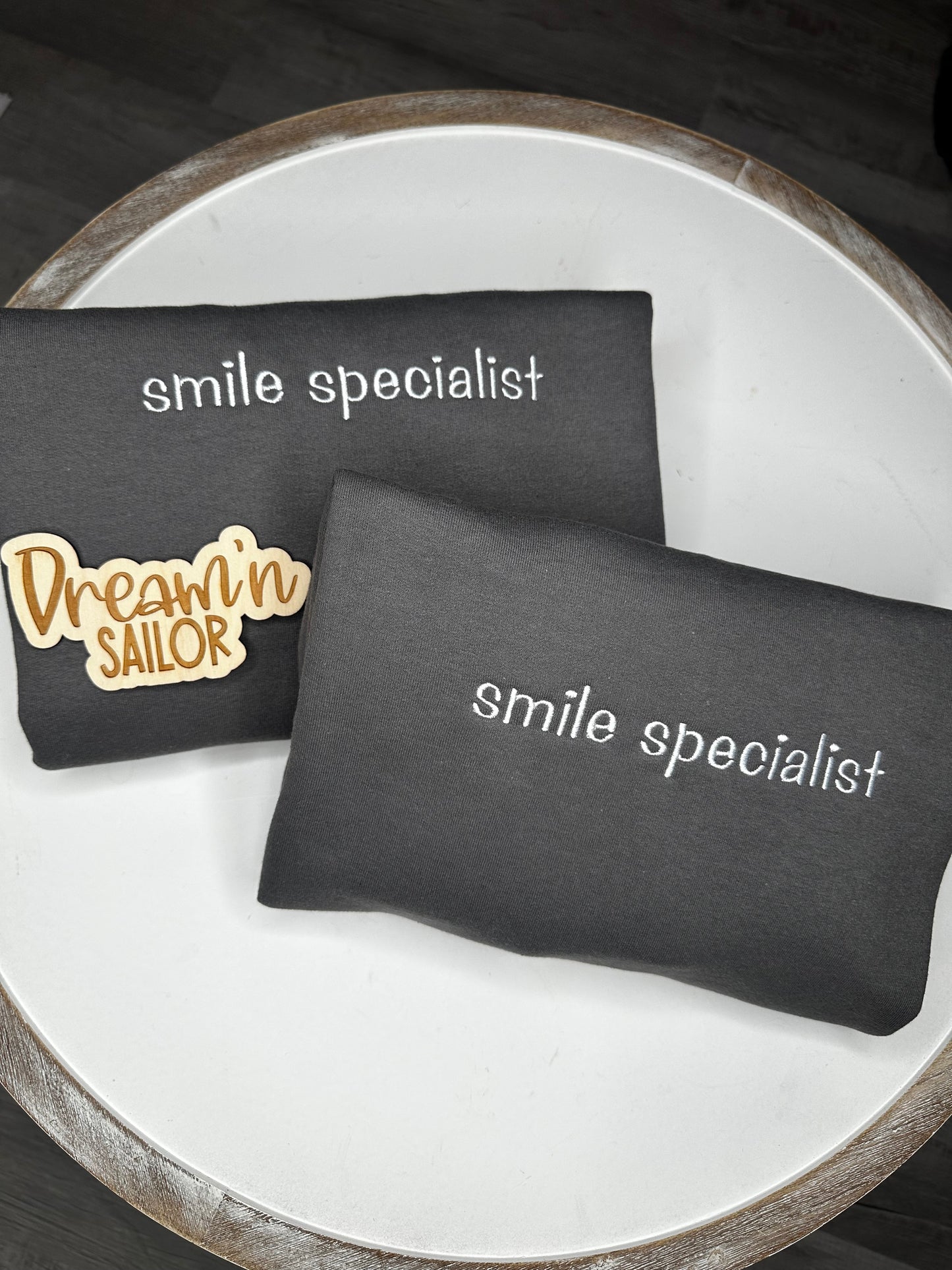 Smile Specialist embroidered on crewneck sweatshirt