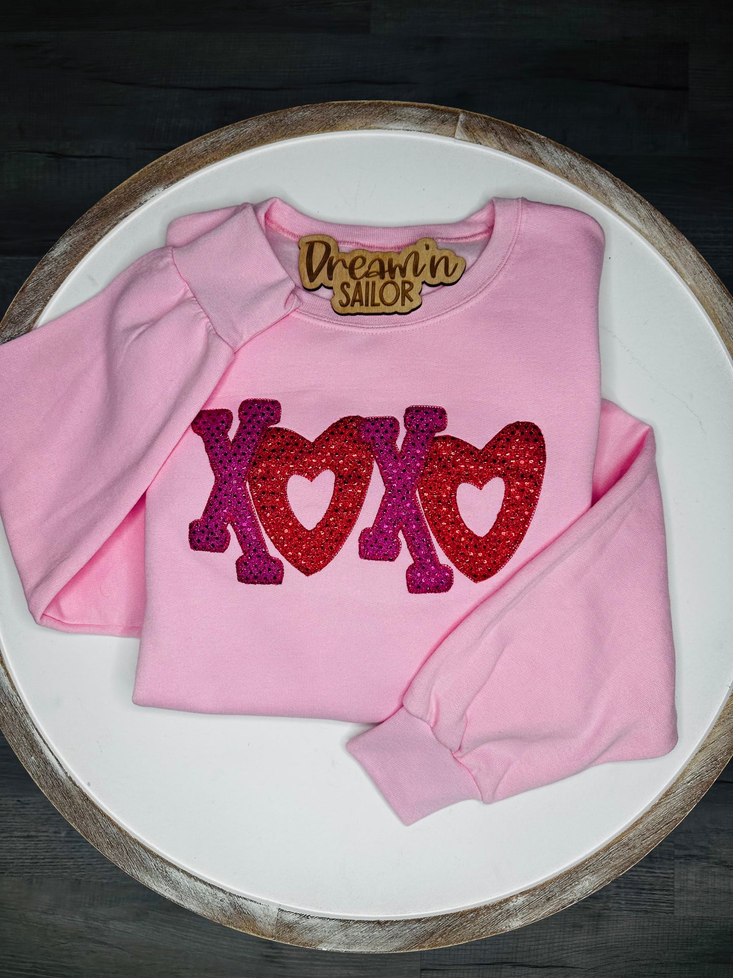 XOXO embroidered appliqué with fabric.
