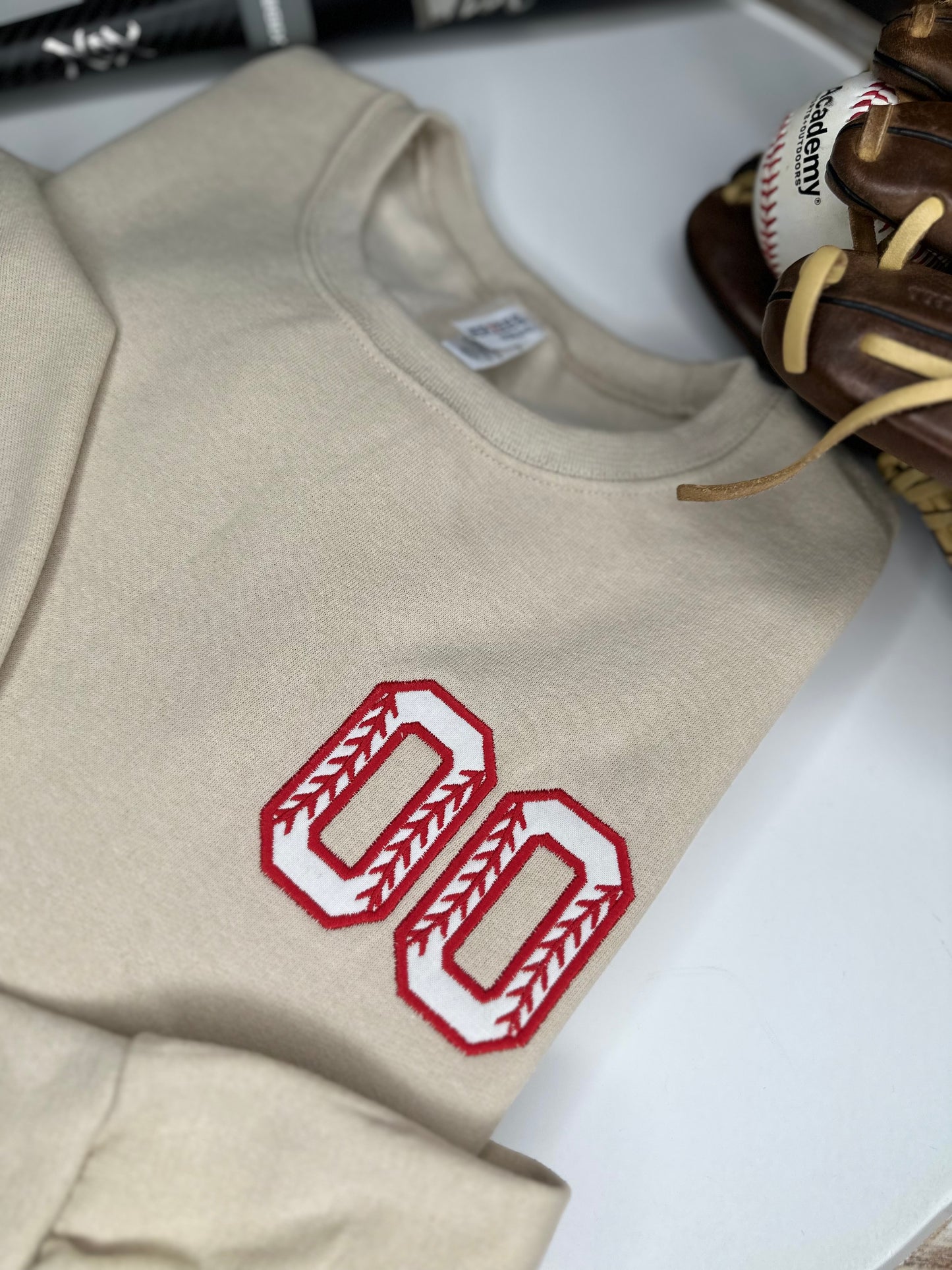 Custom Baseball or Softball Number on left chest logo and personalized sleeve.
