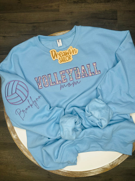 Volleyball Mom custom embroidery with sequins appliqué inside of Volleyball and player name on the sleeve.