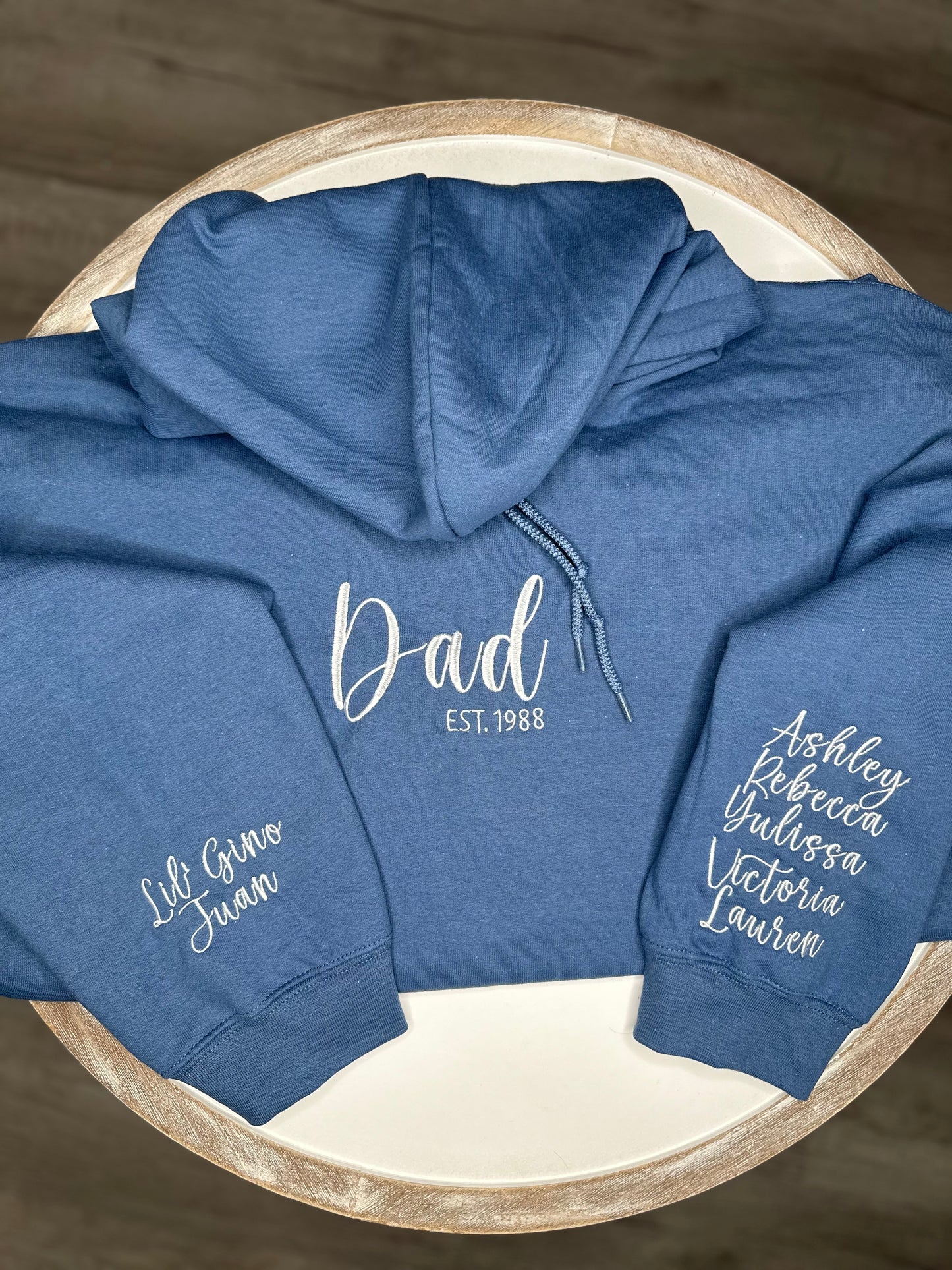 Custom Dad embroidered hoodie with personalized sleeve with kids names.