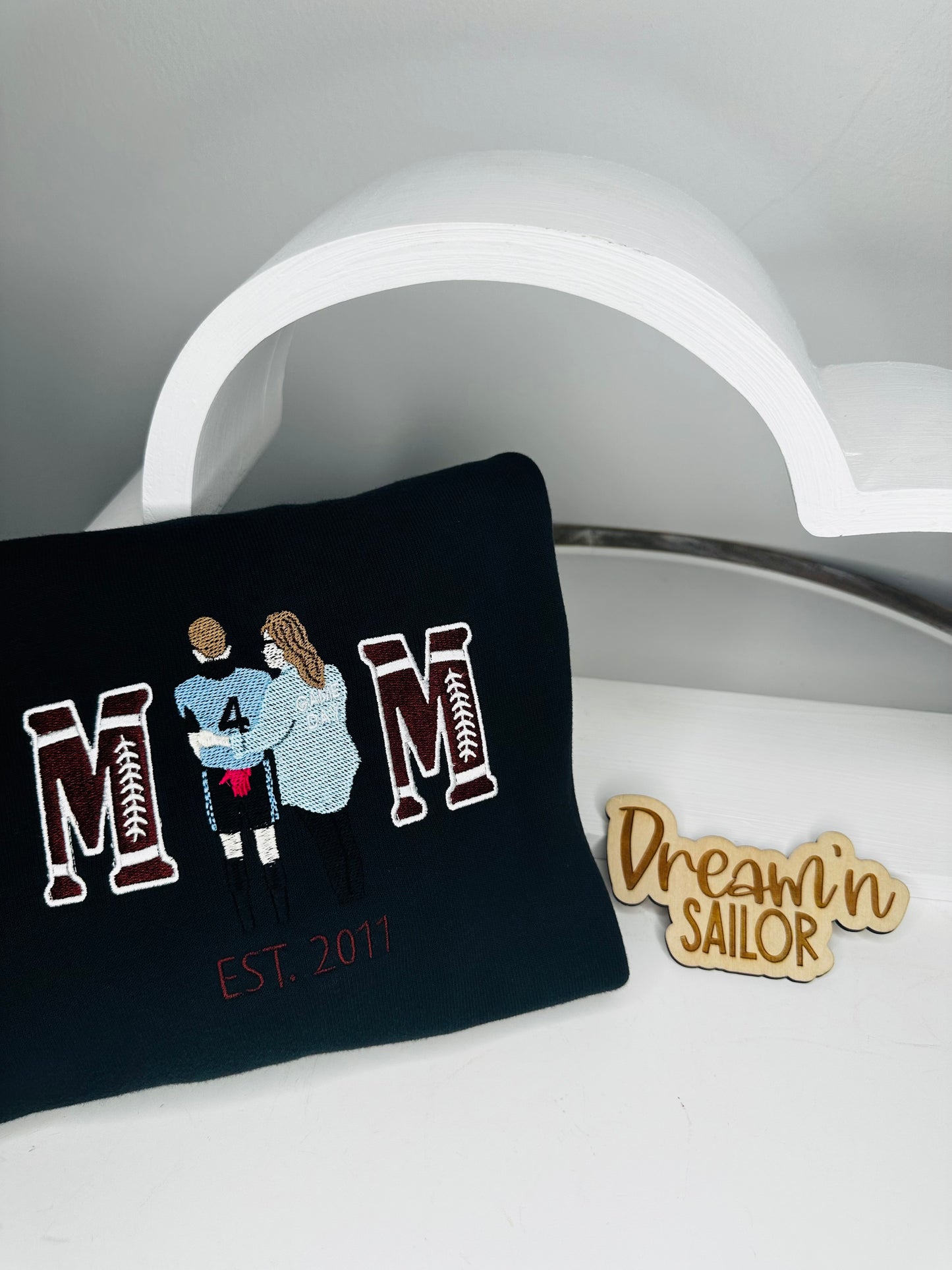 Custom mom crewneck sweatshirt with picture embroidered as the “o” and M’s in football font.